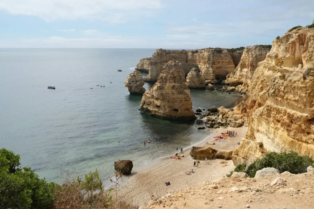 Golden cliffs and a sandy cove on the Algarve coast, Portugal