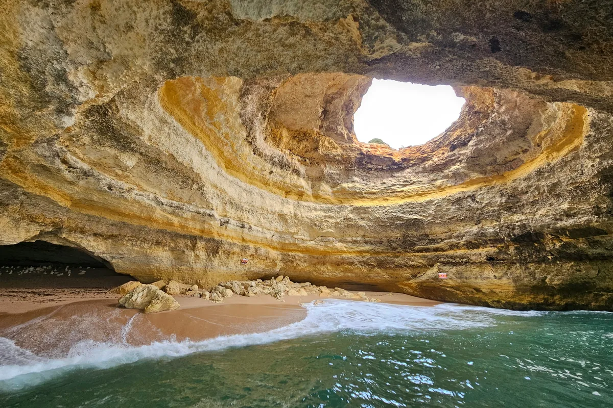 Sunlight through the roof of the Benagil sea cave in the Algarve