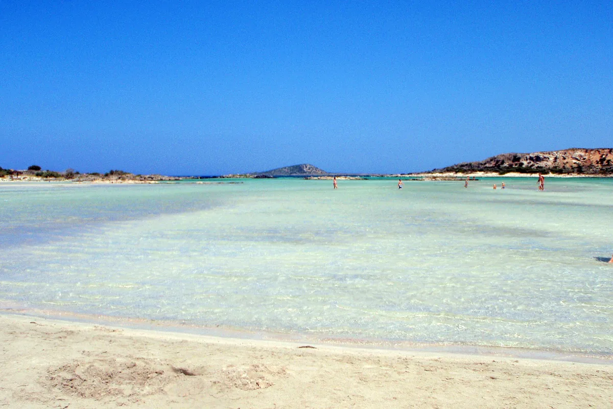 Elafonissi beach on Crete with pale sand and shallow turquoise lagoon