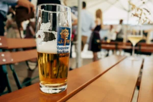 A glass of Augustiner beer on a table in a Munich beer garden