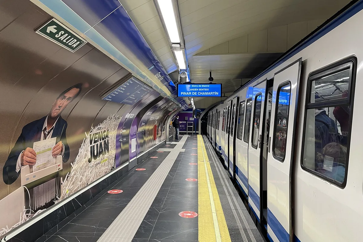 A train at the platform of Gran Via Metro station in Madrid