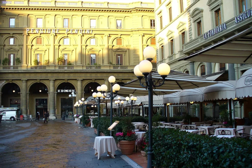 Cafe terraces on Piazza della Repubblica in Florence at dusk