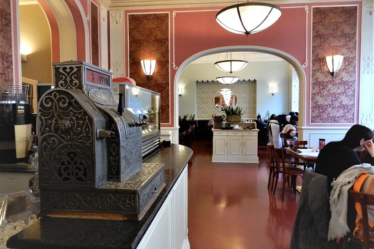 The pink-walled interior of Café Louvre on Národní třída, Prague