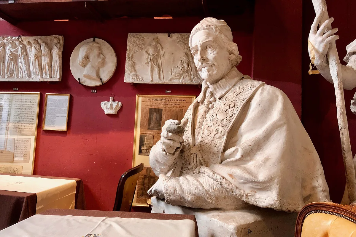 Plaster sculptures beside the tables inside Caffè Canova Tadolini on Via del Babuino in Rome