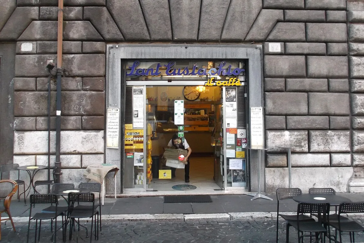 The entrance and neon sign of Sant'Eustachio Il Caffè on Piazza di Sant'Eustachio in Rome