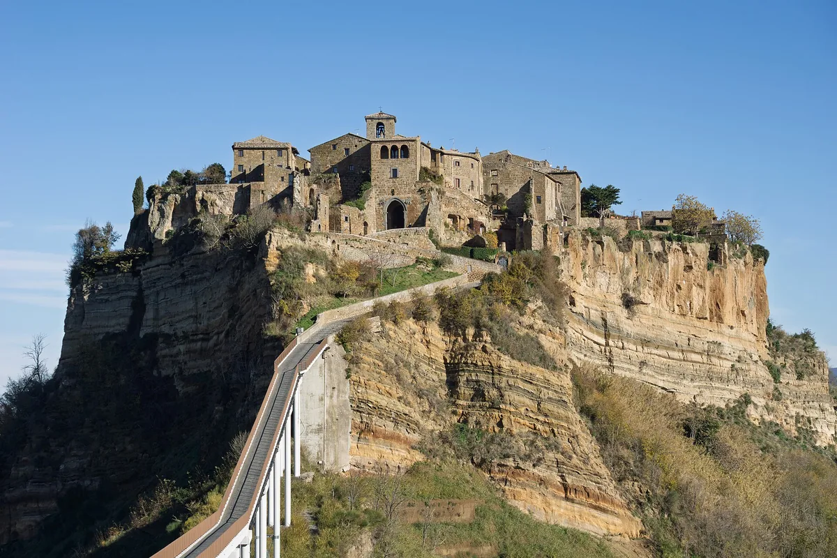 The village of Civita di Bagnoregio on its pillar of rock, with the footbridge leading up to it