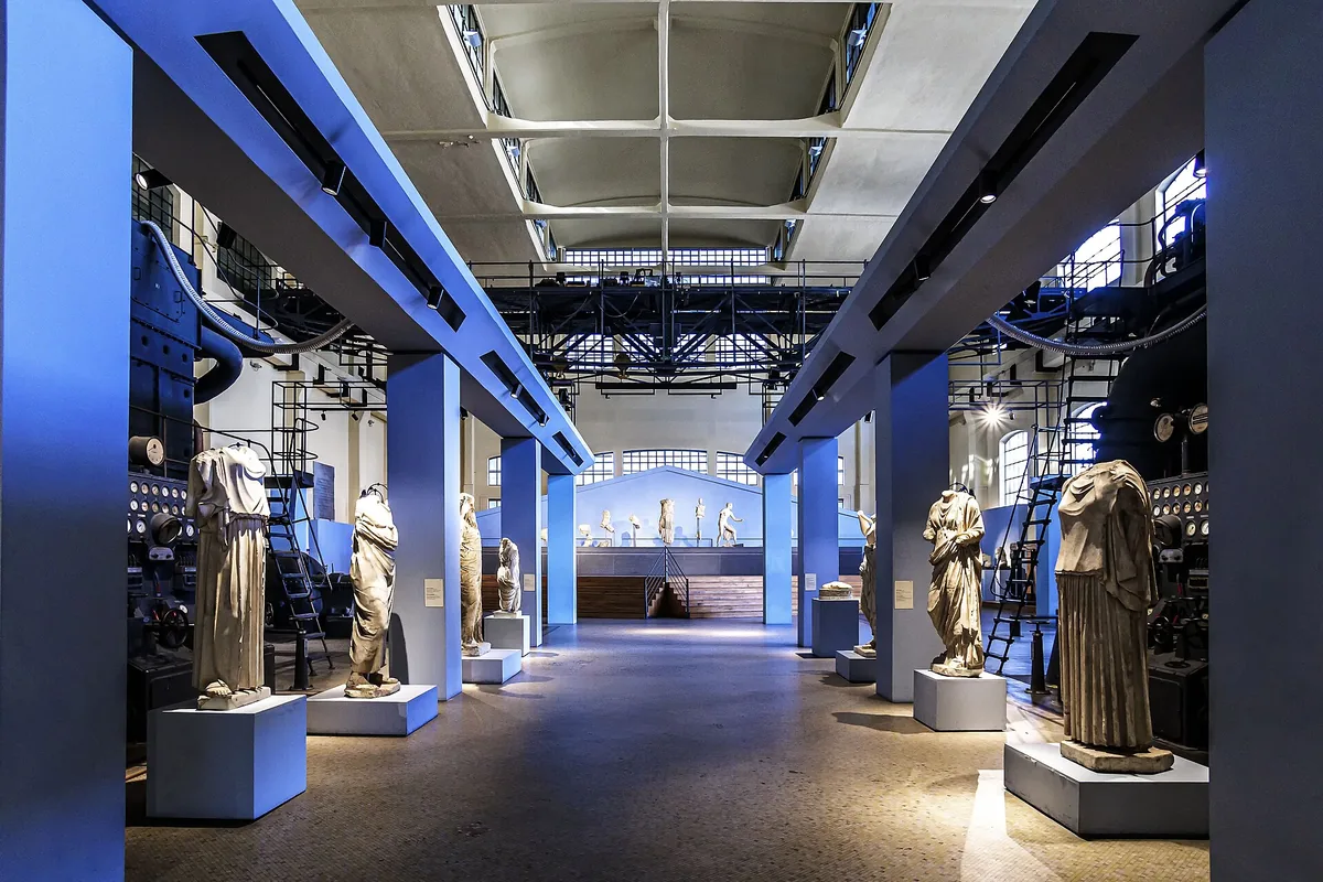 Ancient Roman statues lining the machine hall of Centrale Montemartini, Rome