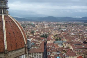 Florence Duomo dome above the terracotta rooftops of the city