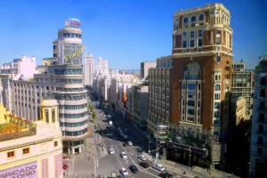 Gran Via in Madrid seen from a rooftop, with the Edificio Carrión and Schweppes sign