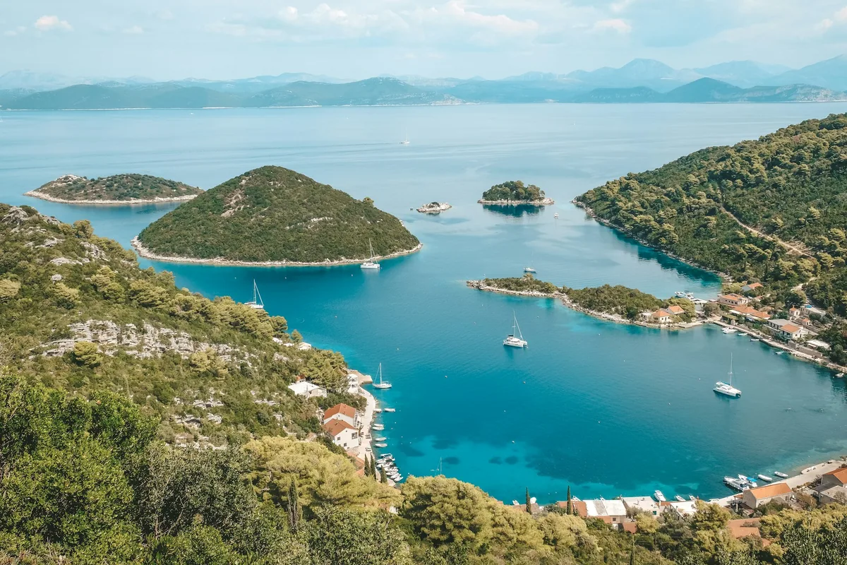 Green islets and a sheltered turquoise bay on the island of Mljet