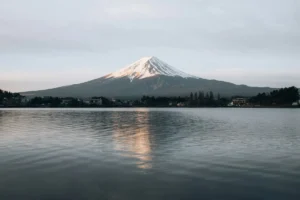 Snow-capped Mount Fuji reflected in a calm lake, a classic day trip from Tokyo