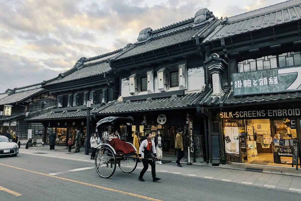 Traditional kurazukuri warehouse-style shopfronts on a street in Kawagoe's old town