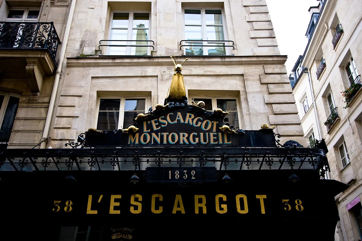 The gilded snail and sign above L'Escargot Montorgueil on Rue Montorgueil in Paris