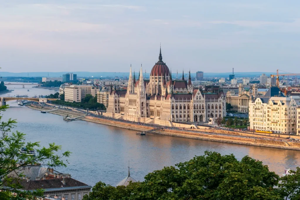 Hungarian Parliament Building beside the Danube in Budapest at dusk