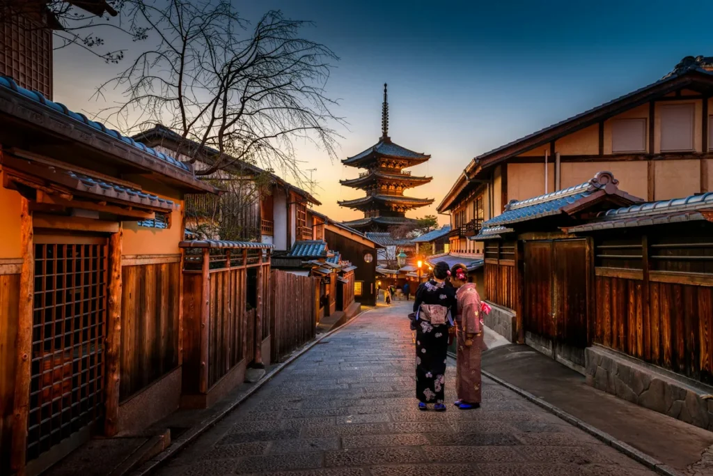 Yasaka Pagoda rising above a traditional wooden street in Higashiyama, Kyoto