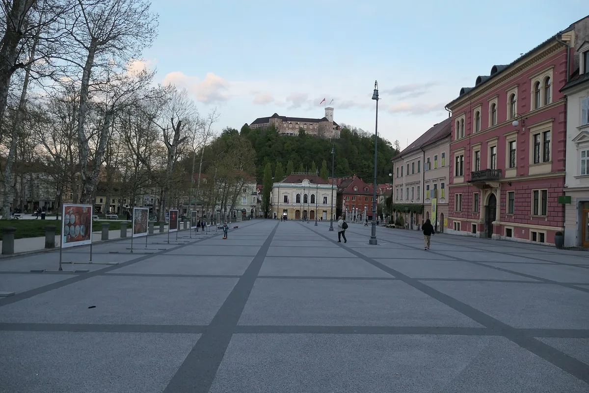 Kongresni trg, a central square in Ljubljana, with the castle hill beyond
