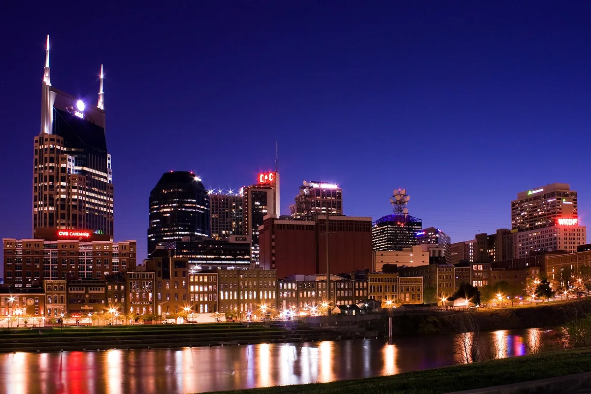 Downtown Nashville skyline at dusk across the Cumberland River