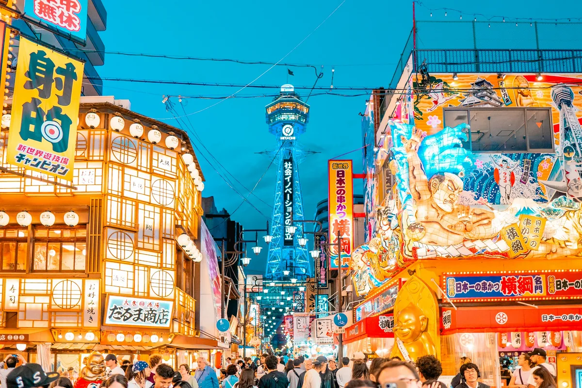 Tsutenkaku Tower and glowing signs in the Shinsekai district, Osaka