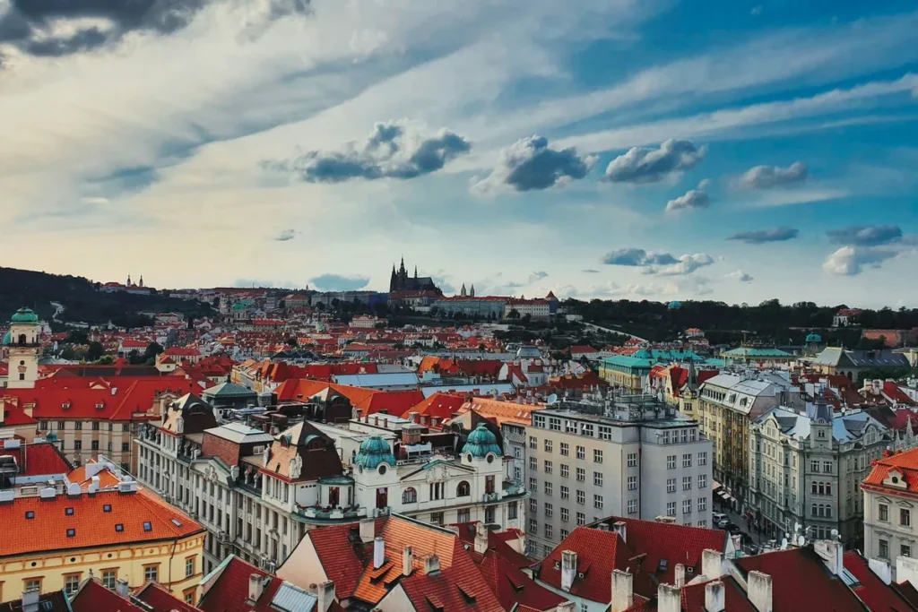 Red rooftops of Prague Old Town with Prague Castle on the skyline