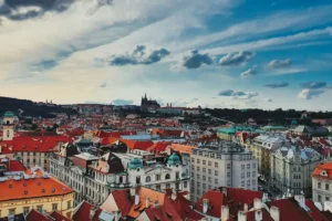 Red rooftops of Prague Old Town with Prague Castle on the skyline
