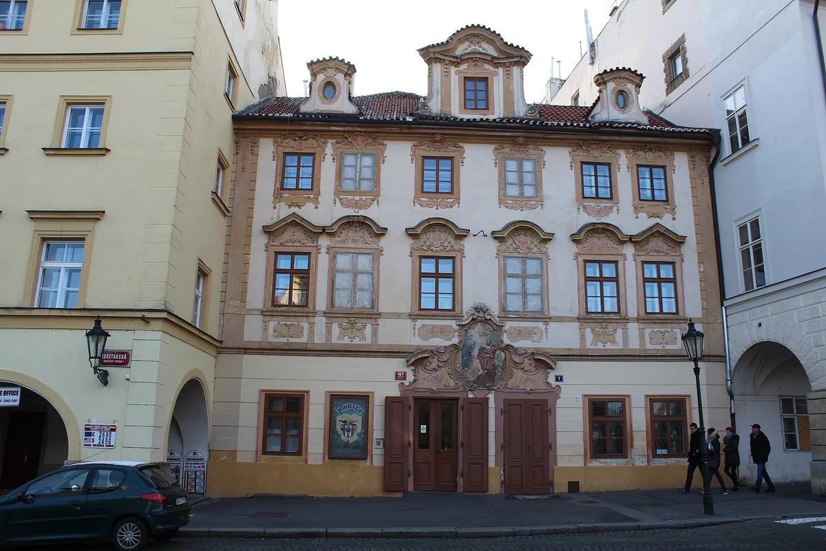 The painted baroque facade of the house U Černého vola on Loretánské náměstí, Prague, home of the pub of the same name