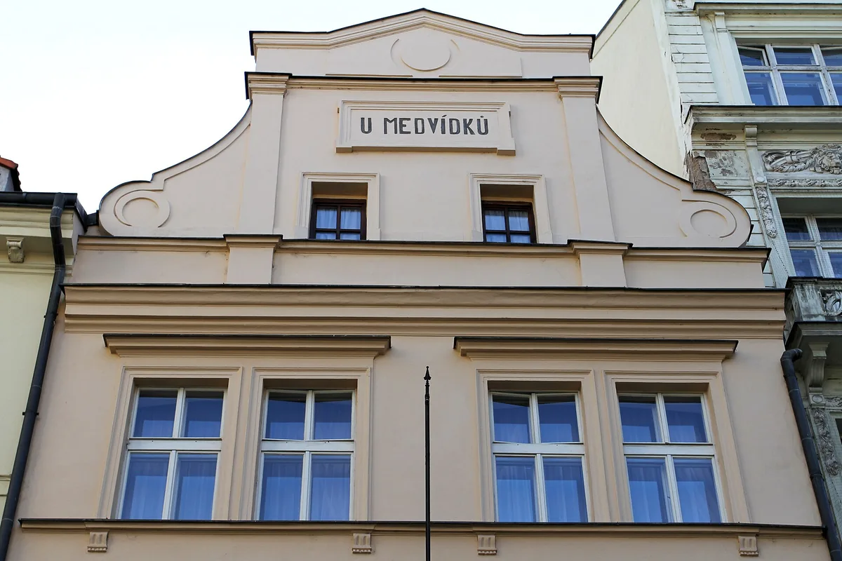 The gabled facade of U Medvídků on Na Perštýně in Prague's Old Town, with its name on the gable