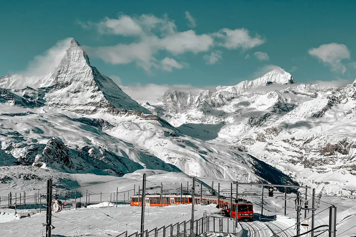 Gornergrat railway train in the snow below the Matterhorn above Zermatt